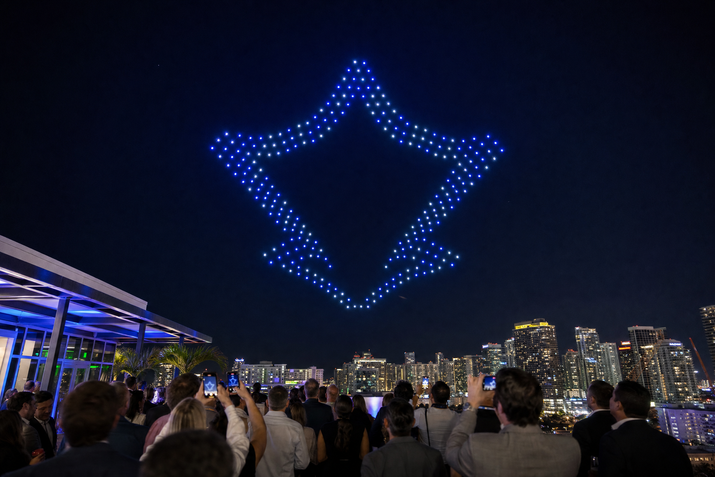 Corporate event drone show displaying company logo